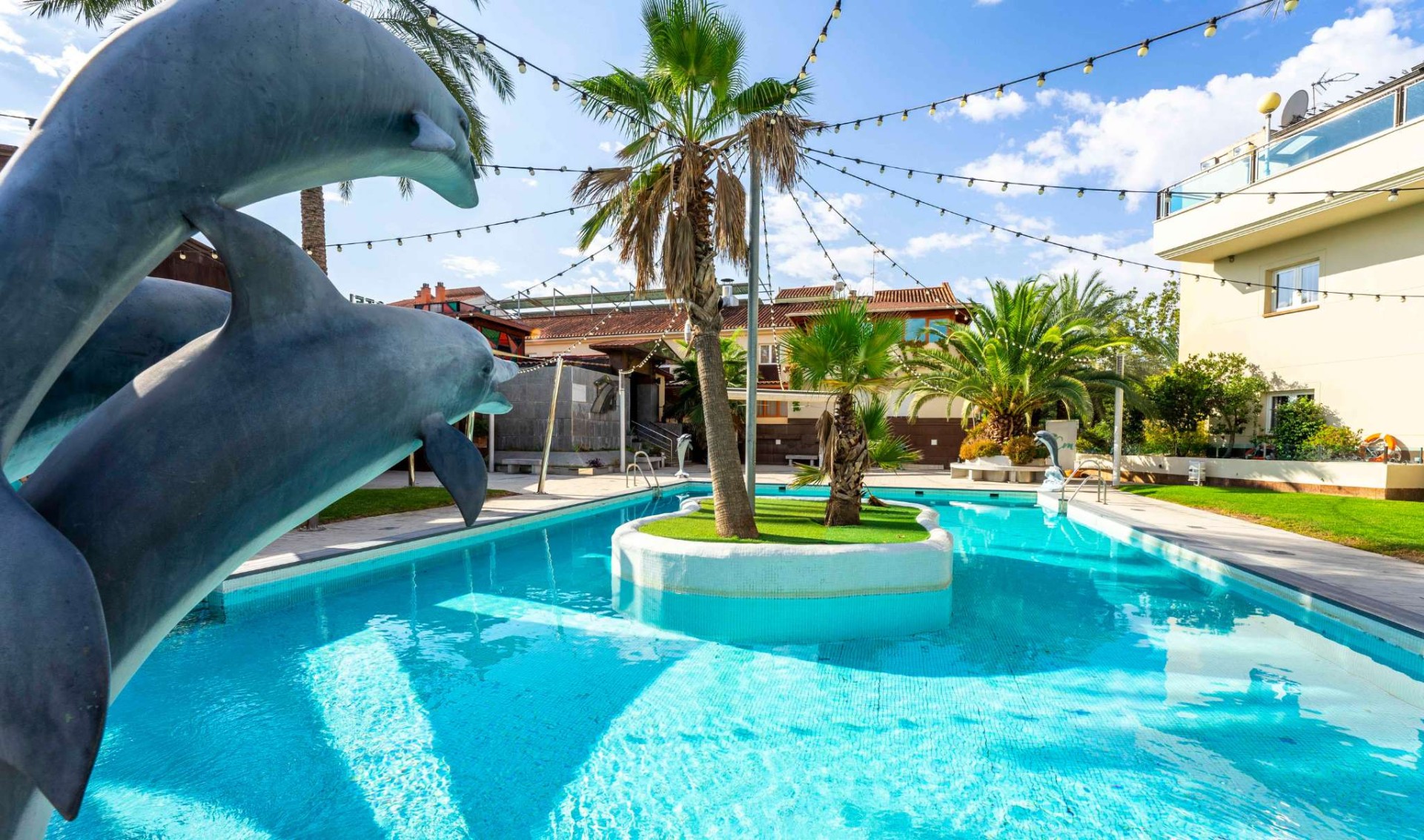 pool  with dolphins at checkin camino de granada hotel