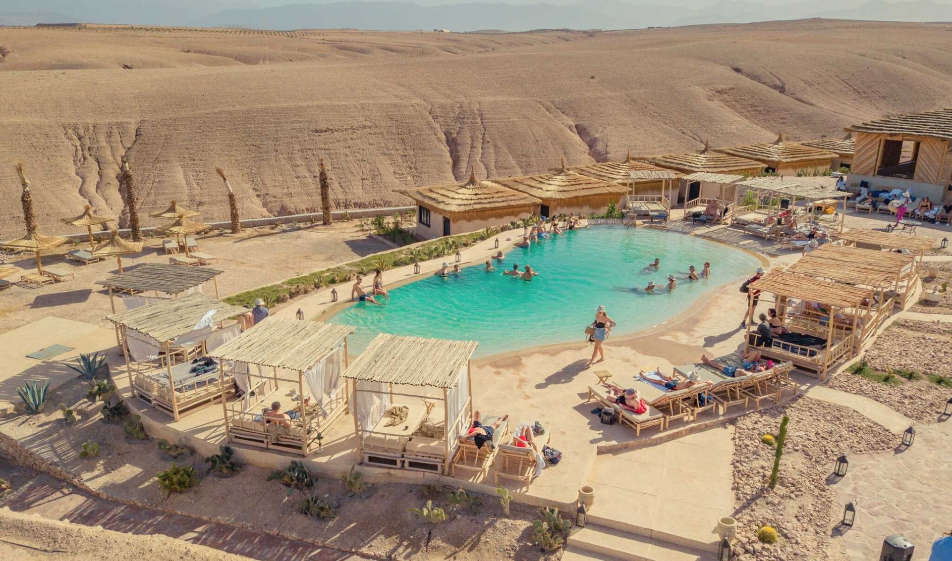 main pool with views to Agafay desert in Morocco DWO Le Bedouin hotel